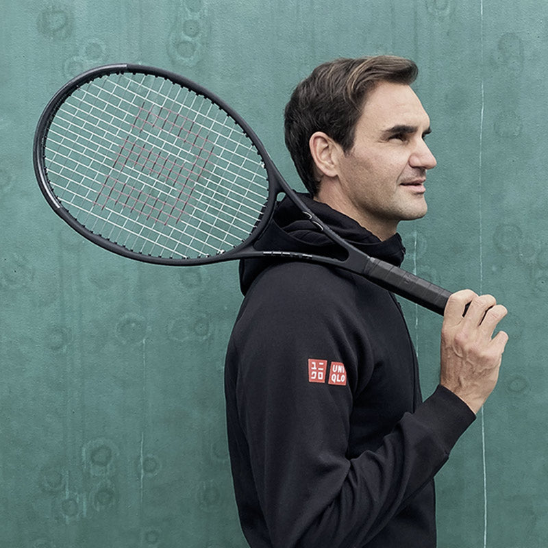 Roger Federer holding a Wilson Pro Staff tennis racquet.